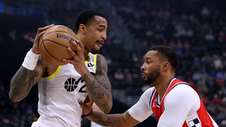 John Collins #20 of the Utah Jazz is guarded by Norman Powell #24 of the LA Clippers...