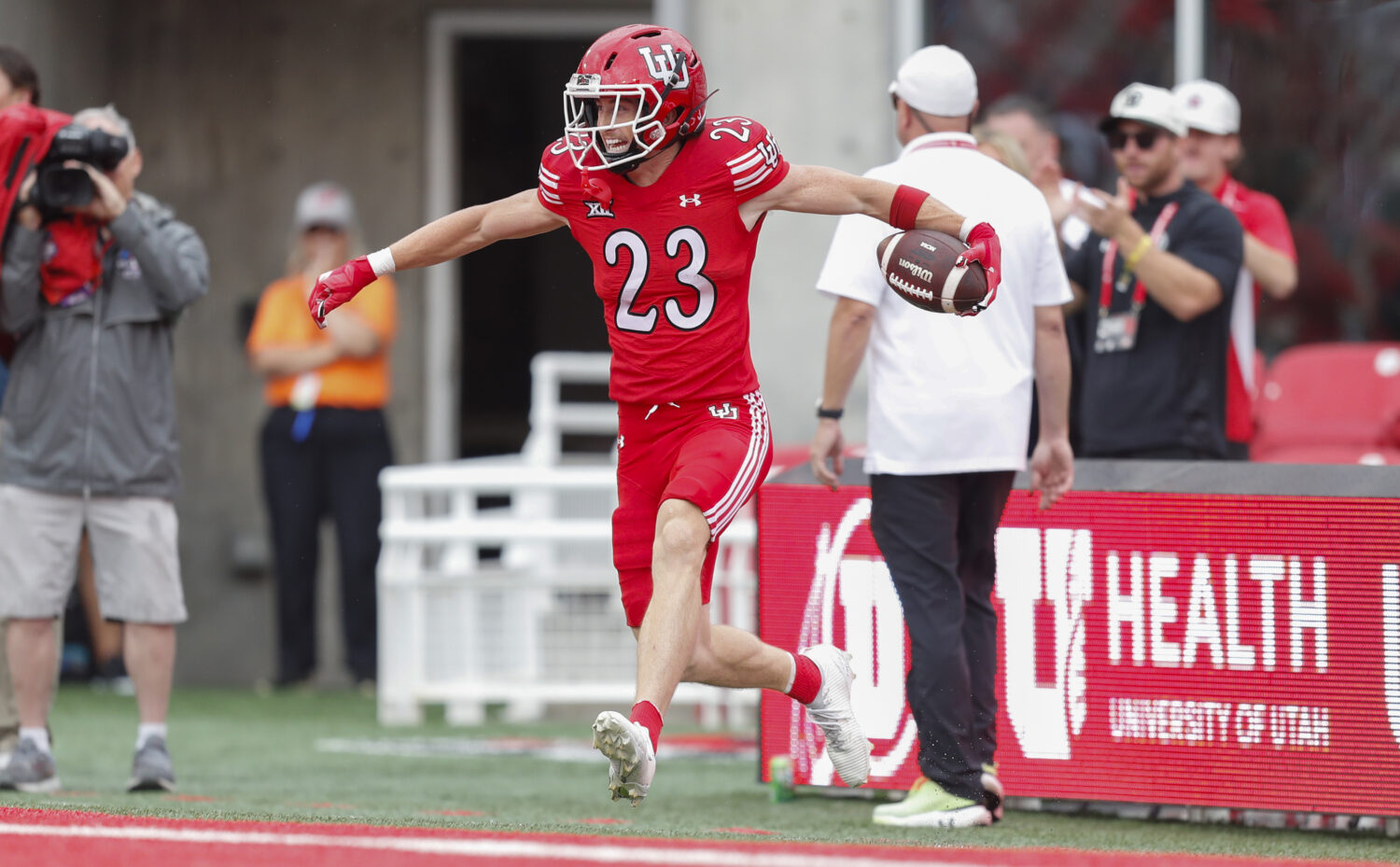 Utah's Jackson Bennee about to celebrate with teammates after pick-six....