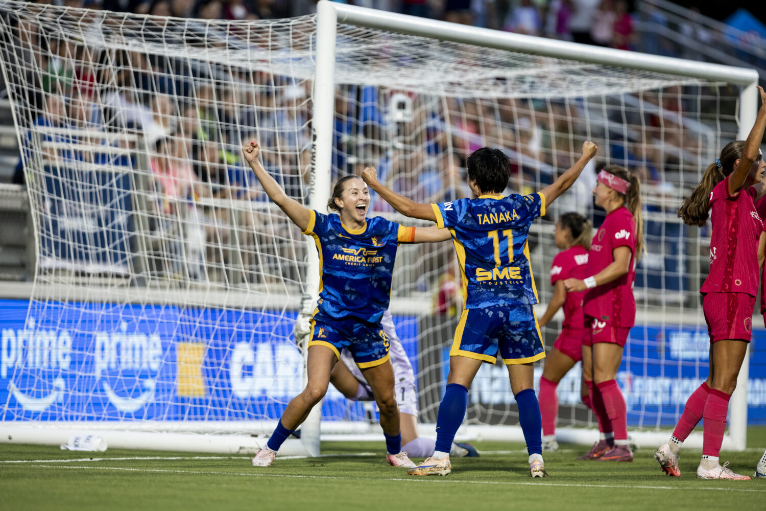 Utah Royals FC center back Kate Del Fava celebrates a goal with Mina Tanaka during the clubs' 4-1 w...