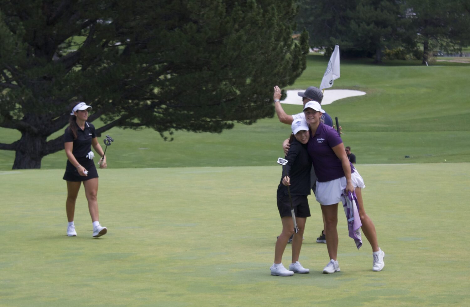Weber State rising junior Braylyn Bayer hugs former BYU golfer Sunbin Seo after shooting 1-under 71...
