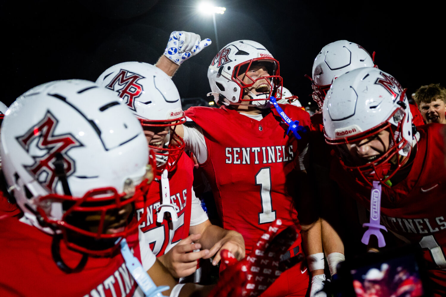 The Mountain Ridge Sentinels celebrate after winning in a 6A high school football game against the ...
