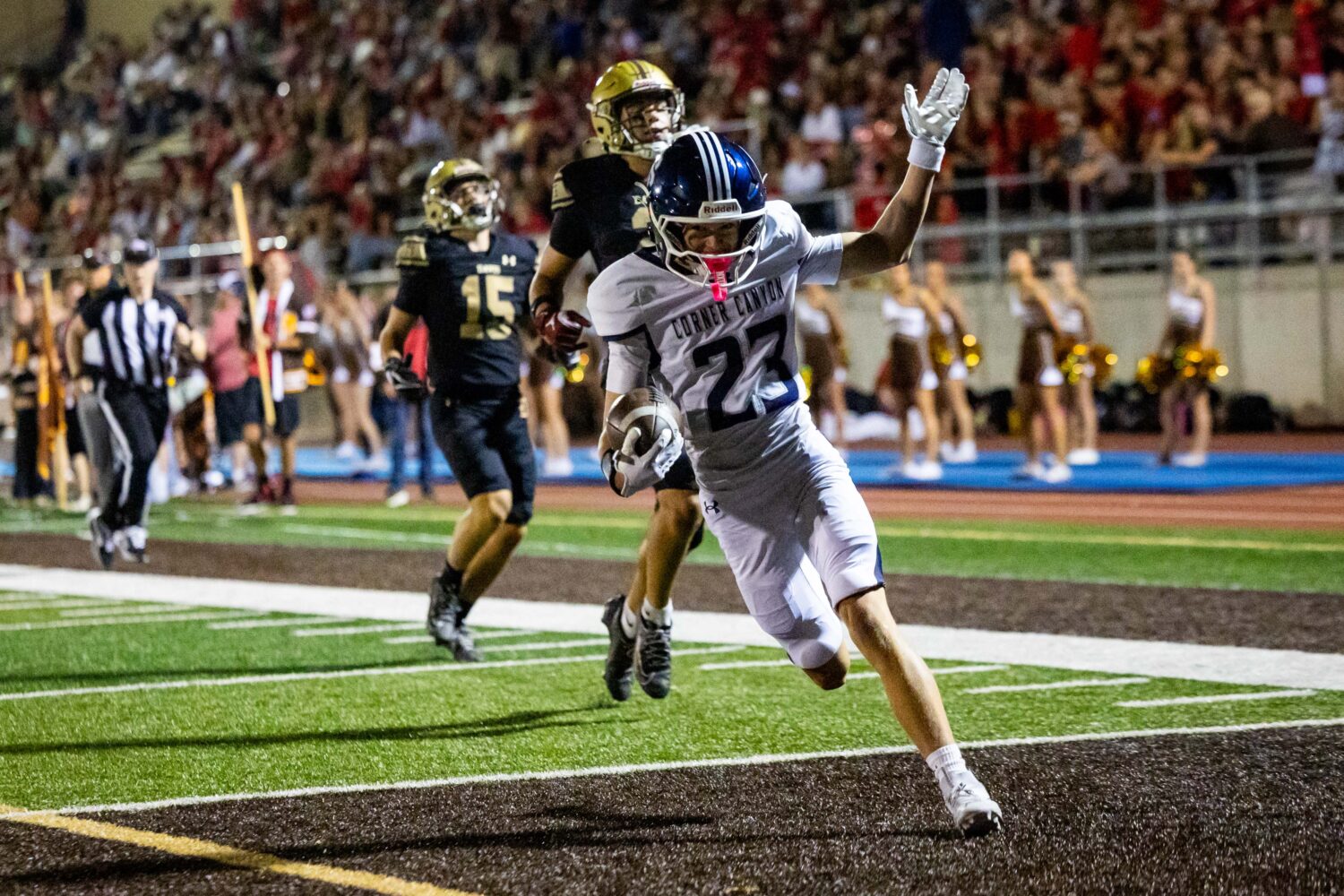 Corner Canyon Chargers wide receiver Beckam Coon (23) runs to the end zone with the ball to score a...