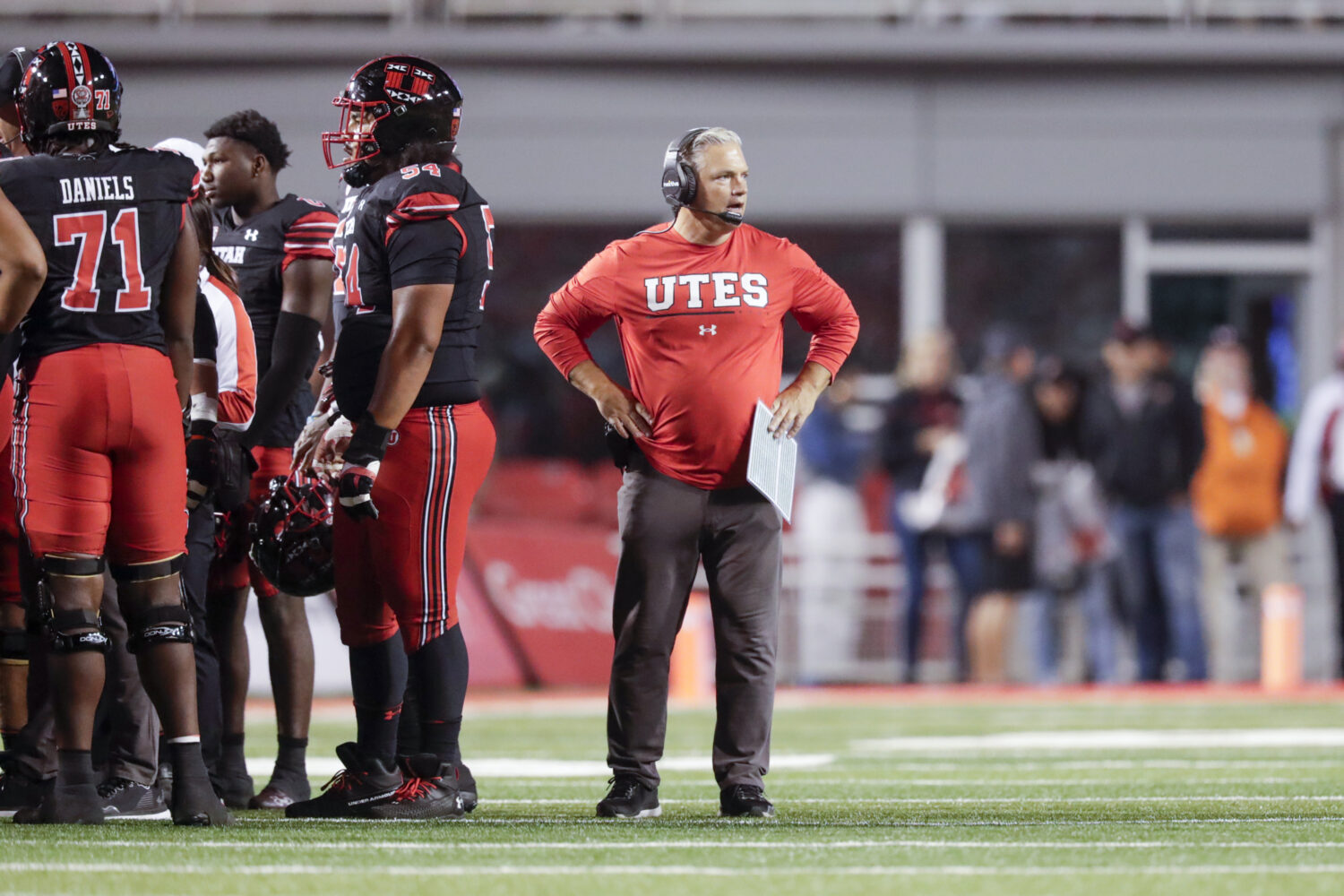 Freddie Whittingham, Utah's tight ends coach, stands on the field while a playing is under review d...