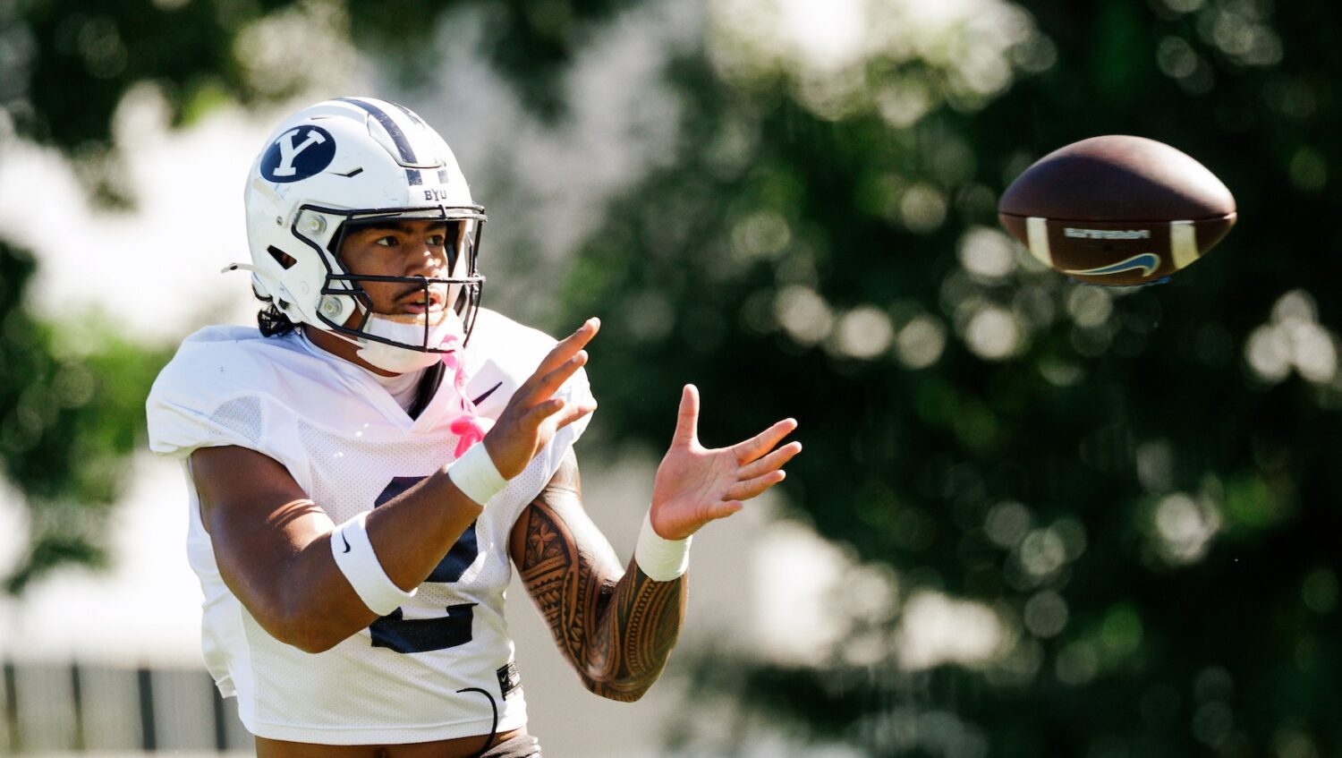 Oregon transfer tight end Roger Saleapaga catches a pass during BYU training camp, Aug. 25, 2026 in...