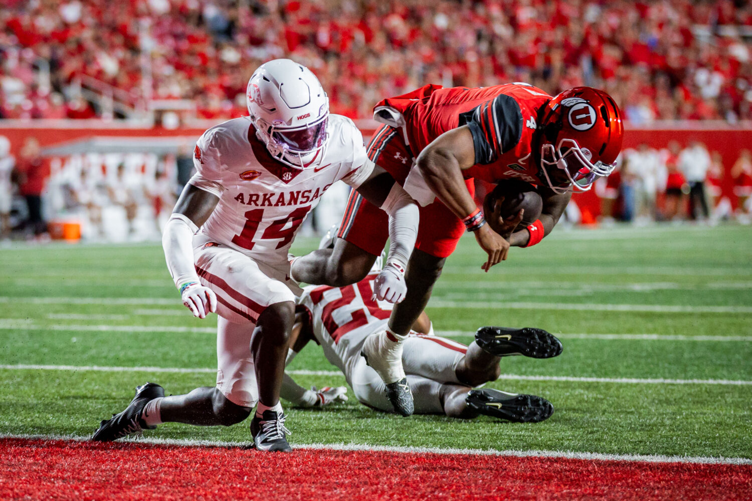 Utah Utes quarterback Devon Dampier (4) jumps to score a touchdown during a football game against t...