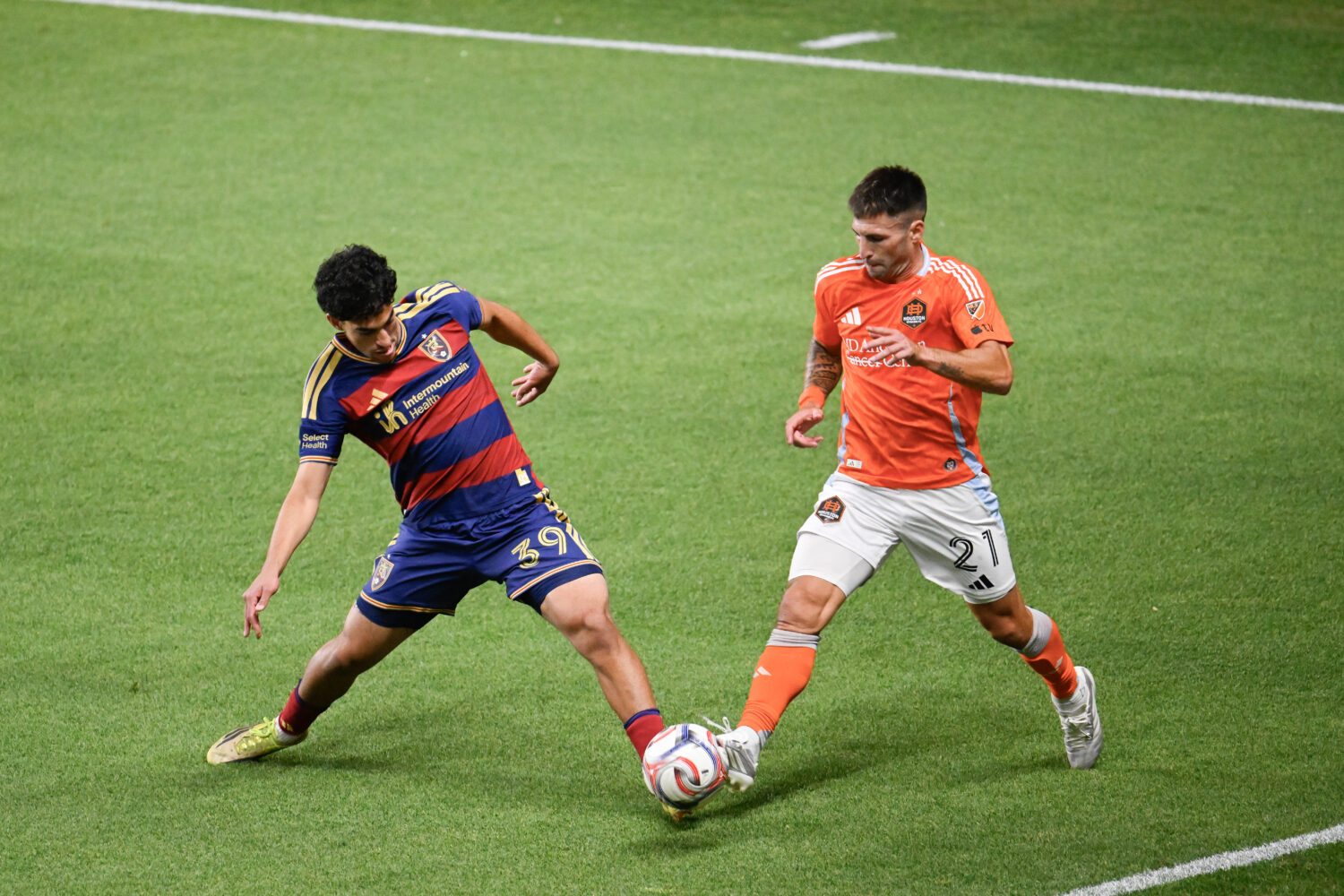 Aiden Hezarkhani #39 of the Real Salt Lake and Franco Negri #21 of the Houston Dynamo FC battle for...